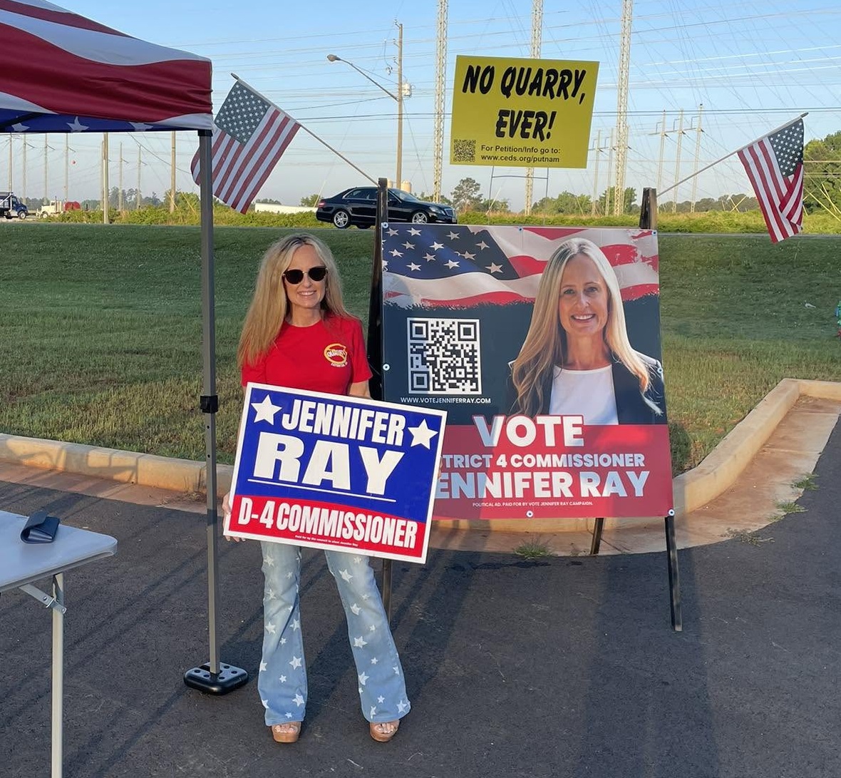 Jennifer Ray with campaign yard signs